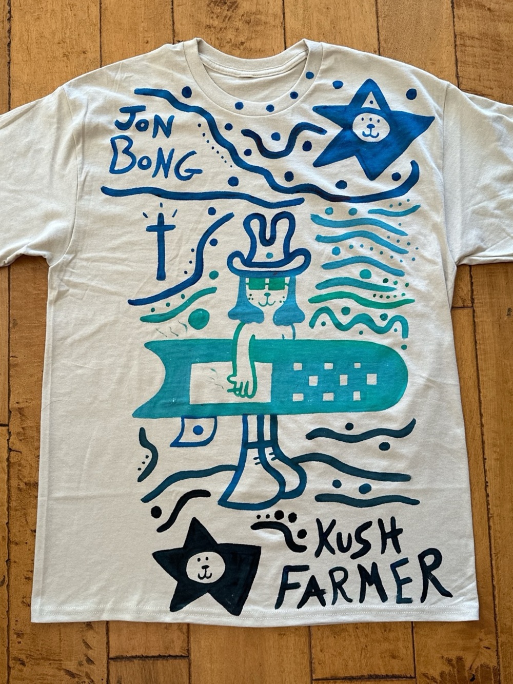 White Graphic Tee by - Blue & Teal Surf Character